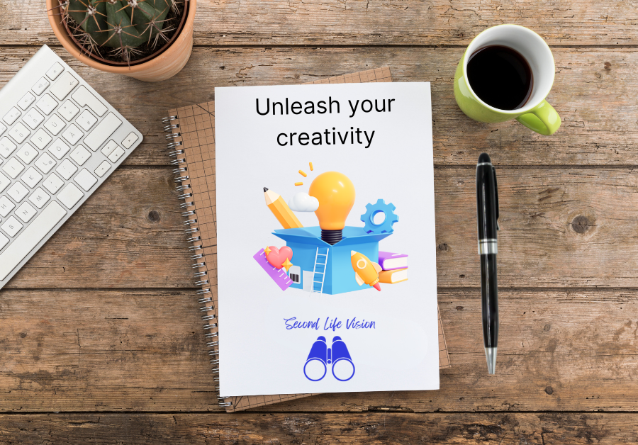 Notebook with "Unleash your creativity" on the page on a desktop beside a laptop keyboard, a pen, and a cup of coffee